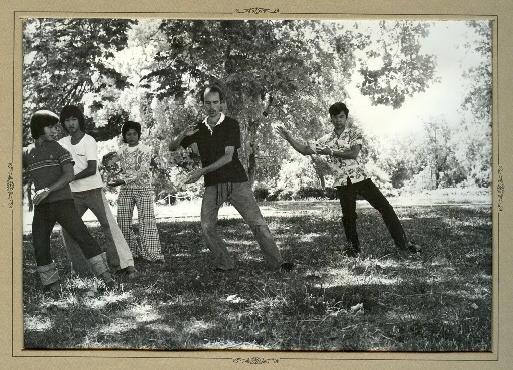 Teaching Southeast Asian refugees Tai Chi at the Buddhist Council for Refugee Rescue and Resettlement, City of Ten Thousand Buddhas, Talmage, CA (June 18, 1981). Left to right: Do Nghi, Huynh Hai Kong, Nguyen Hong Thu Thi, Michel, Luong Phuong Dai