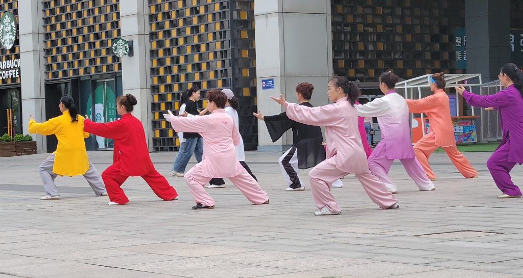 A group of women practicing Tai Chi outdoors in Xi'an, China