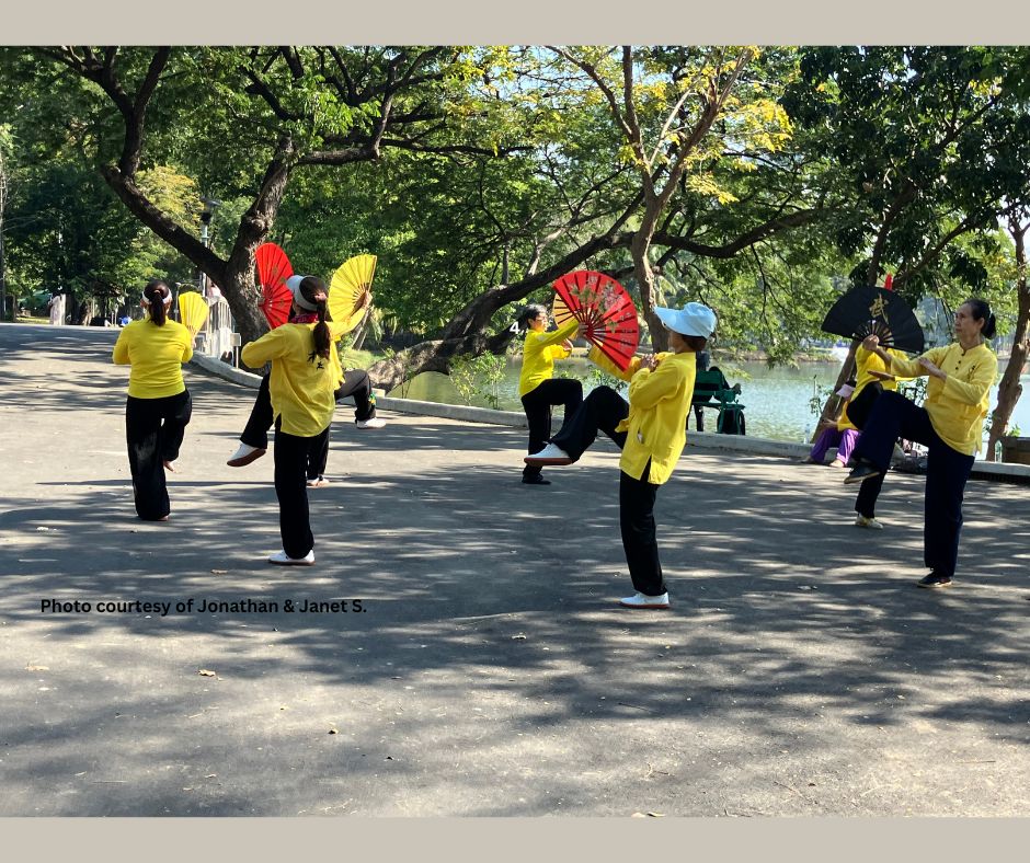 Practicing Tai Chi Fans in Lumphini Park, Bangkok, Thailand.